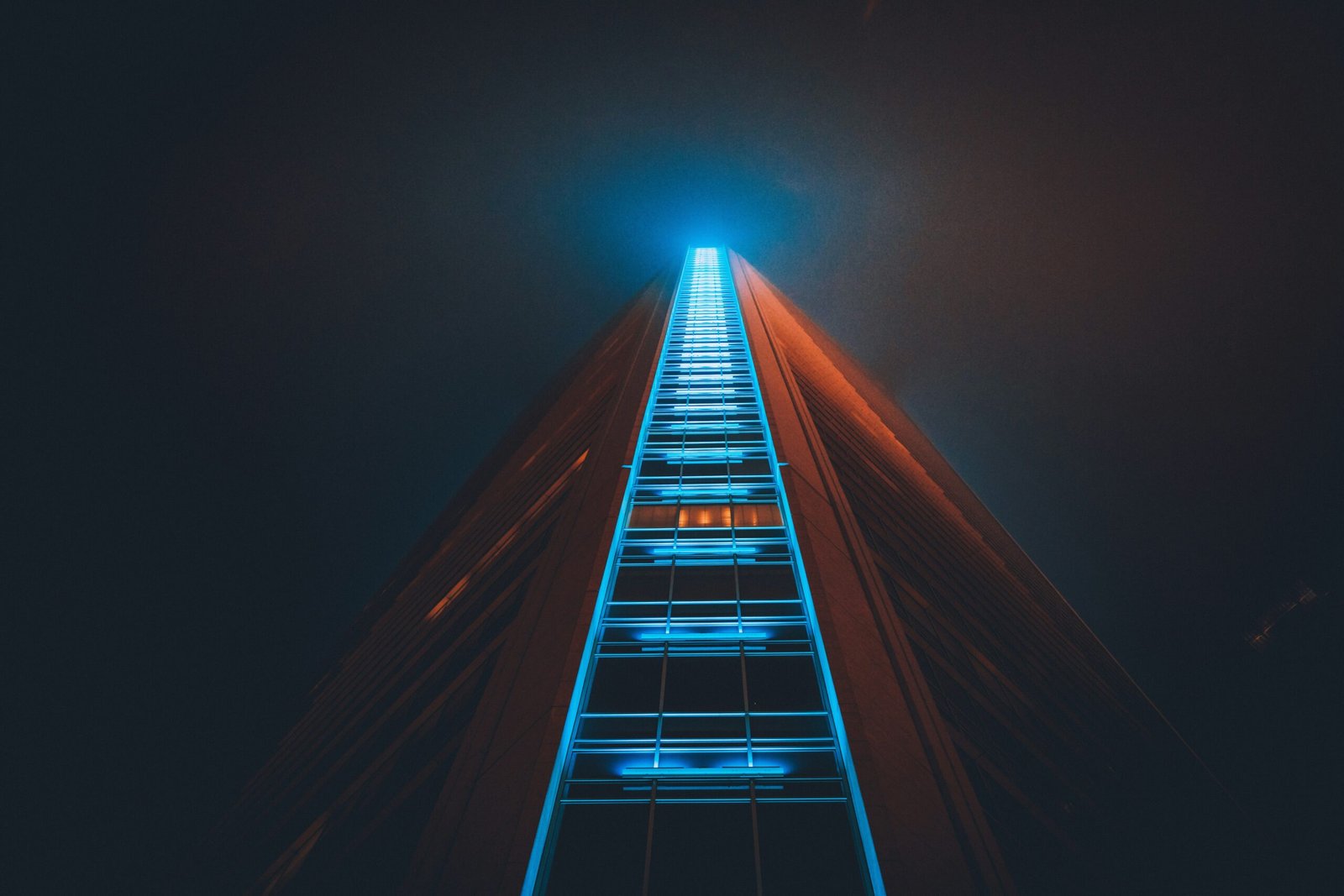 A surreal image of a glowing wooden ladder reaching upward into a dark blue sky with bright light at the top, representing a road to skills that pay forever.